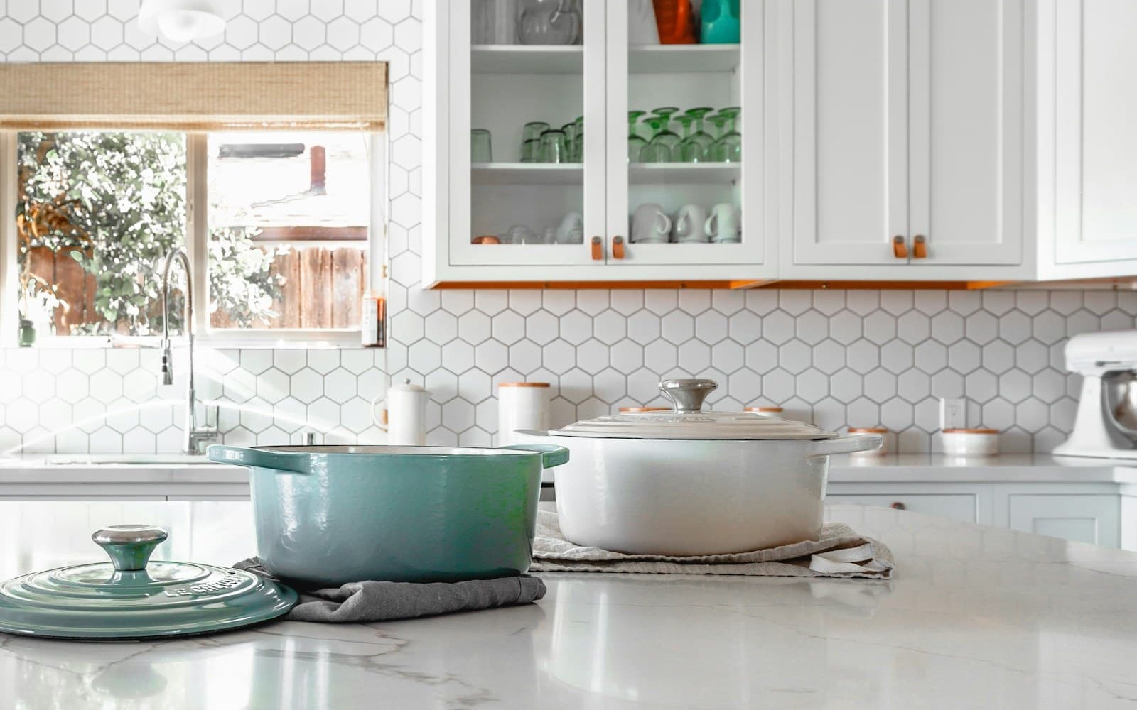 A renovated residential kitchen with new cabinetry and finishes