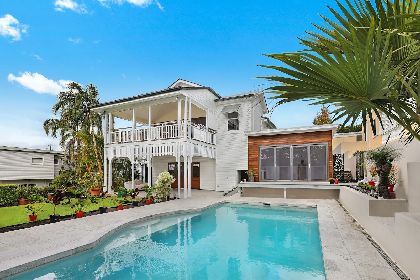 A sunlit suburban house — the kind of Phoenix home a cooling load calculation is sized to