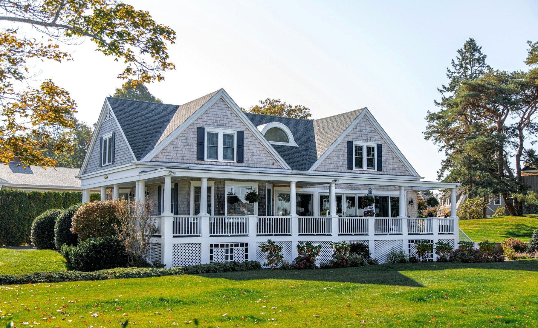 A two-storey house with a wraparound porch — the kind of Richmond-area home a load calculation is sized to