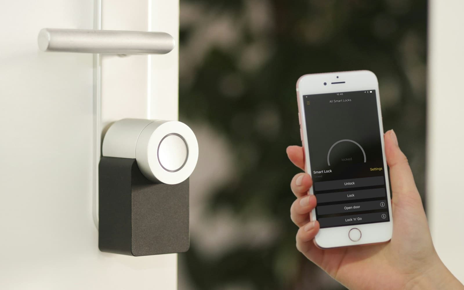 A smart door lock being operated from a phone at a residential entry door