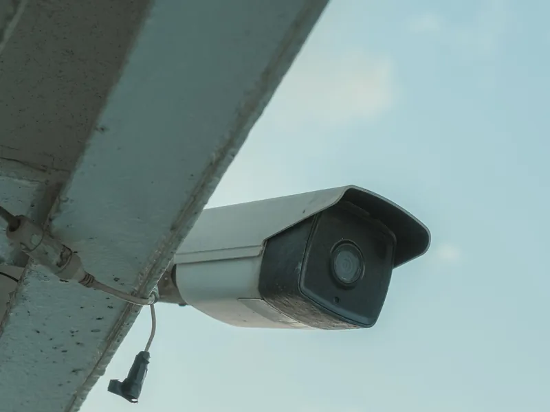 Security camera mounted under the eave of a home